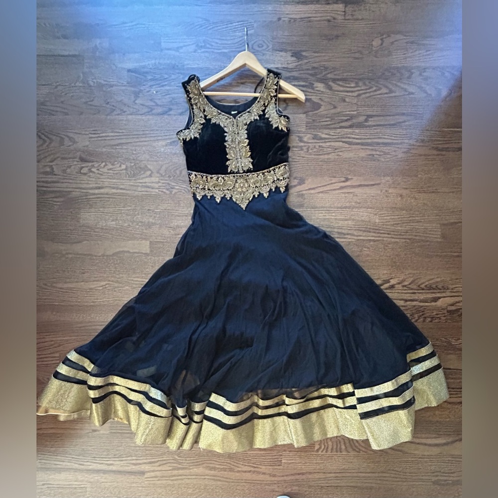 Black Anarkali with rhinestone work, gold border.